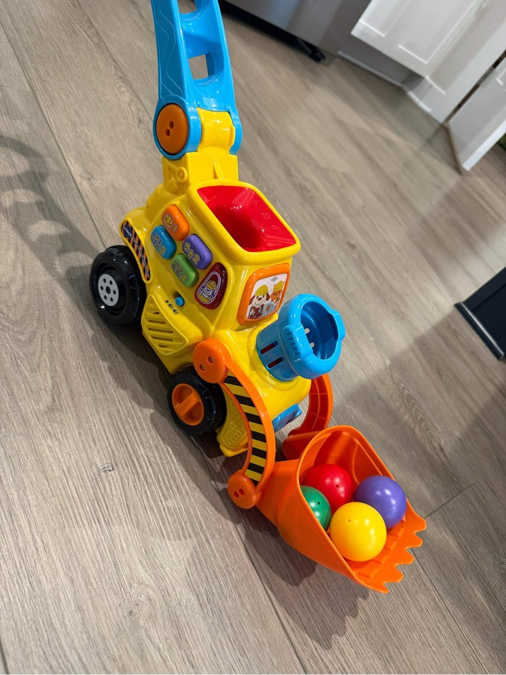 Bright Yellow and Blue Push Excavator Toy with Ball Scoop